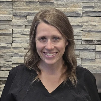 A headshot of Erin Service, a staff member at Pioneer Sports & Pain Center.