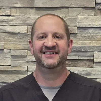 A headshot of Dr. Kyle Burtenshaw, a chiropractor at Pioneer Sports & Pain Center.