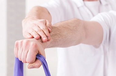Rehabilitation therapy session with exercise equipment and a patient performing guided physical movement.